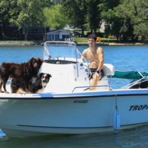 Dogs on Boat with Owner