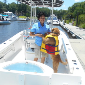 Dog Hugging Woman on Boat