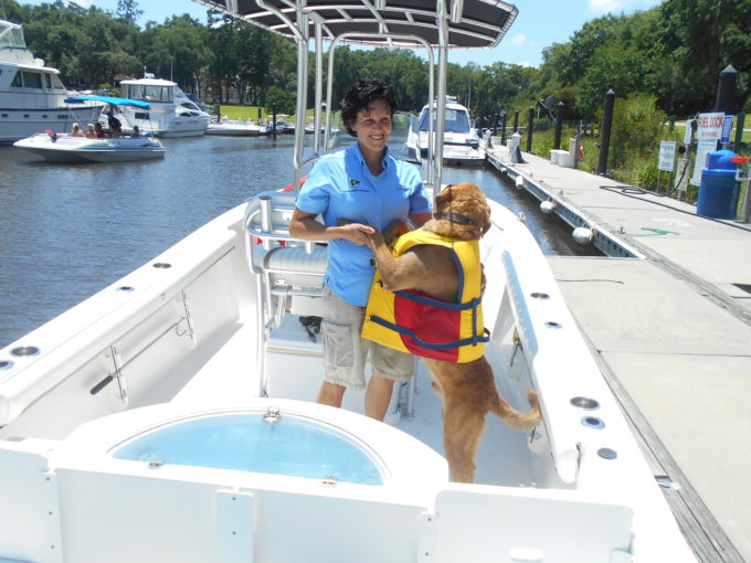 Dog Hugging Woman on Boat