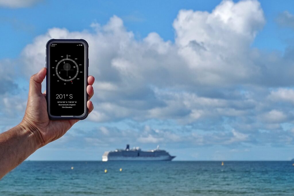 Checking the direction of a cruise ship using the Compass App on an IPhone.